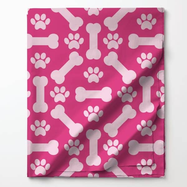 Pink Fabric With A Repeating Pattern Of Light Pink Bones And Paw Prints.