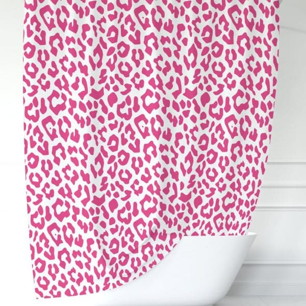 Pink Leopard Print Shower Curtain Draped Over A White Bathtub.