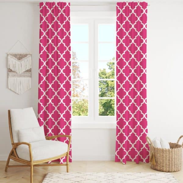 Pink Curtains With A White Quatrefoil Pattern Hang On A Window.