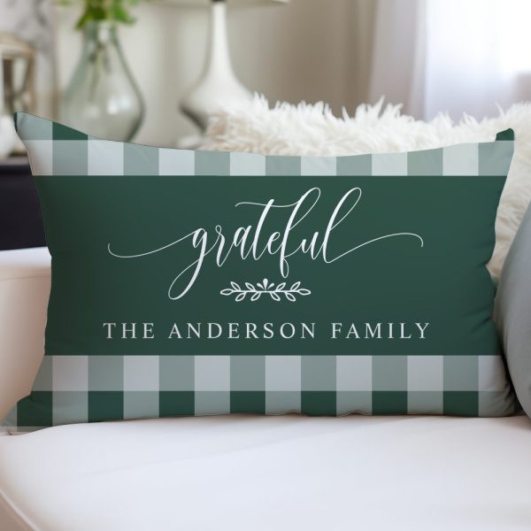 Green And White Gingham Rectangular Pillow With The Word Grateful In A Script Font And The Text The Anderson Family Below.
