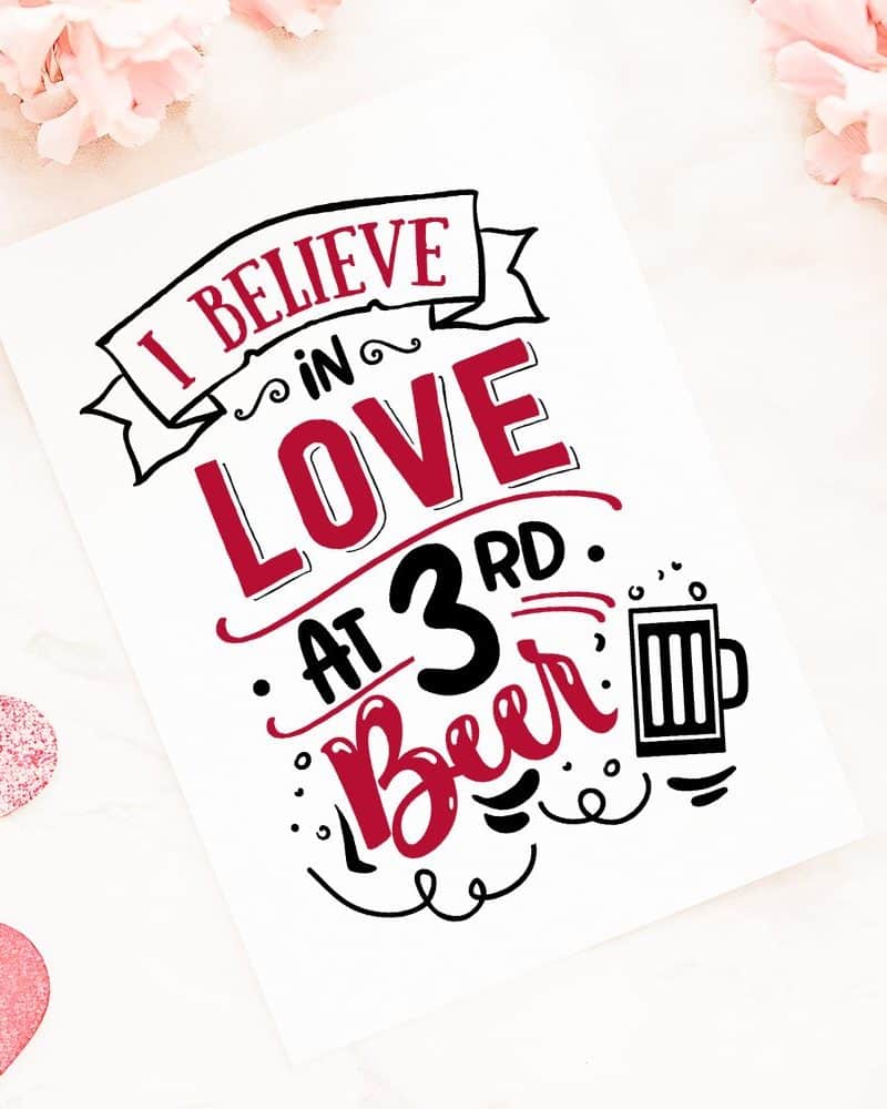 Valentine's Day card with hand-lettered text reading I believe in love at 3rd beer, and a beer mug illustration.