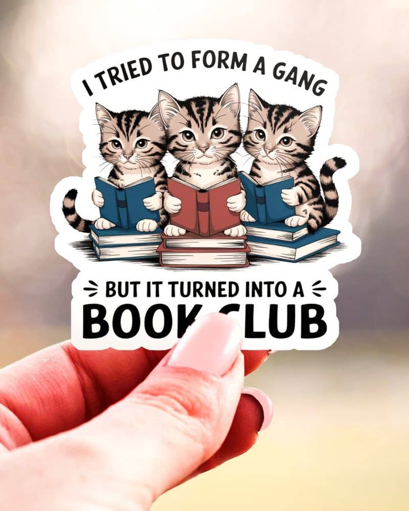 Sticker of three kittens sitting on books, reading. Text above them says, "I tried to form a gang," and below, "But it turned into a book club."