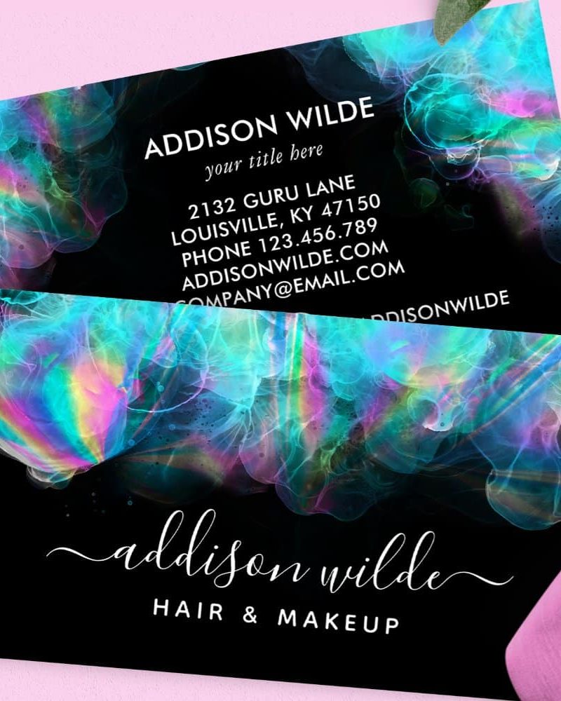 Business card for Addison Wilde Hair & Makeup, featuring a dark background with iridescent teal and purple abstract design.