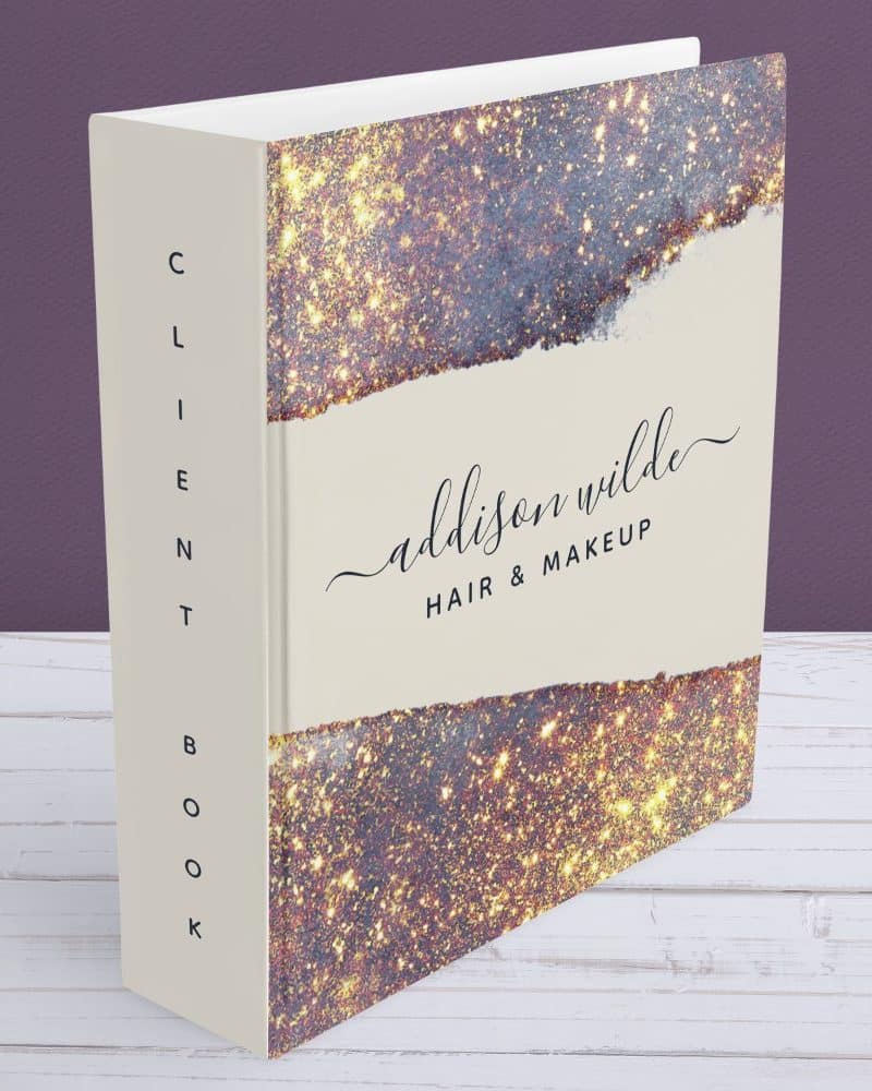Client book with gold glitter design and Addison Wilde Hair & Makeup written on the cover.