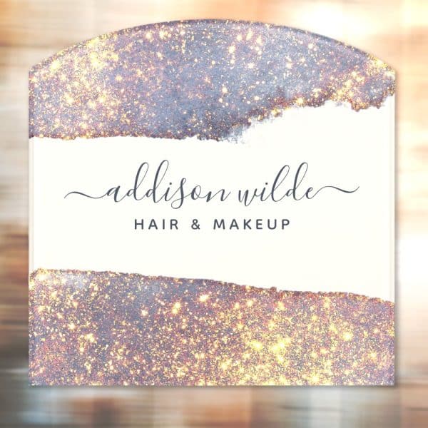 Addison Wilde Hair &Amp; Makeup Logo On A Sparkly, Light Purple And Gold Background.