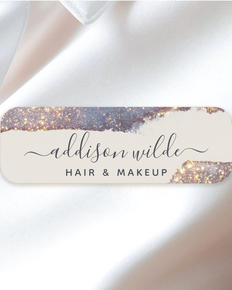 Addison Wilde hair and makeup logo, featuring a sparkly, abstract design.