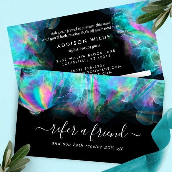 Refer A Friend And Receive 20% Off, Illustrated On A Colorful Business Card Featuring Iridescent Paint Swirls On A Black Background.