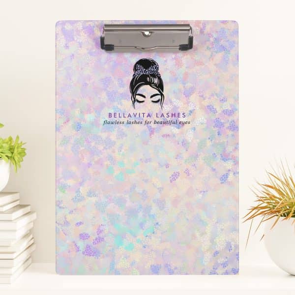 A Pastel-Colored Clipboard With A Logo Featuring A Woman'S Face And The Words Bellavita Lashes.