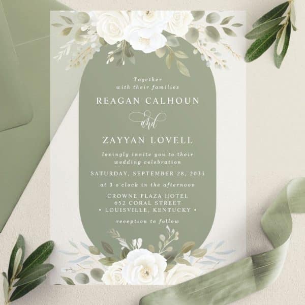 Wedding Invitation With White Flowers And Green Accents, Announcing The Marriage Of Reagan Calhoun And Zayyan Lovell.