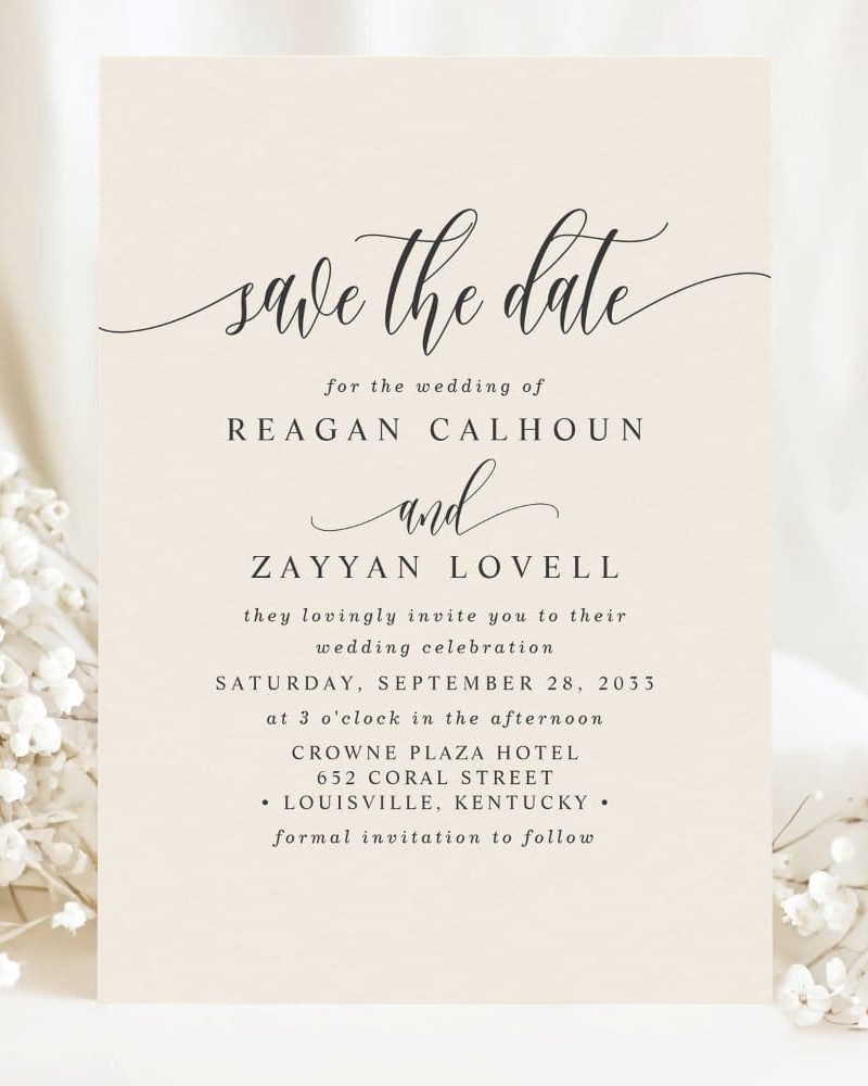 Beige save-the-date card announcing the wedding of Reagan Calhoun and Zayyan Lovell on September 28, 2033, at the Crowne Plaza Hotel in Louisville, Kentucky.