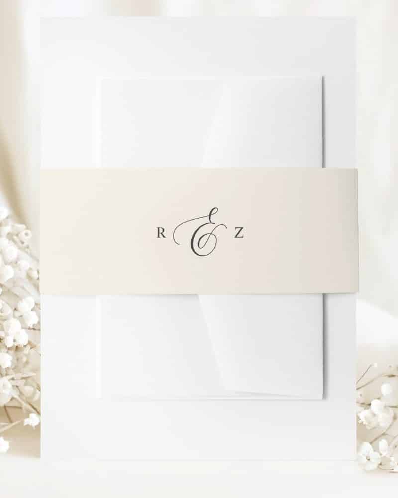 Wedding invitation with a cream band featuring a monogram and the initials R & Z.