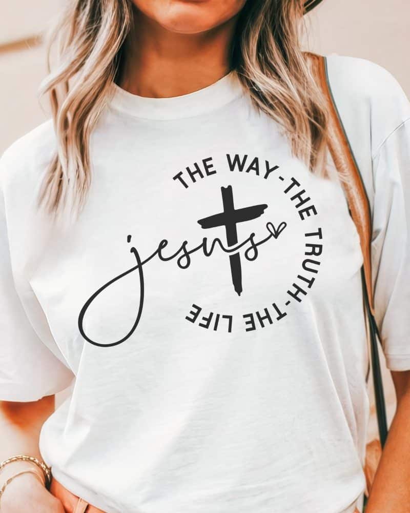 White t-shirt with a black cross and the words Jesus, the way, the truth, the life.