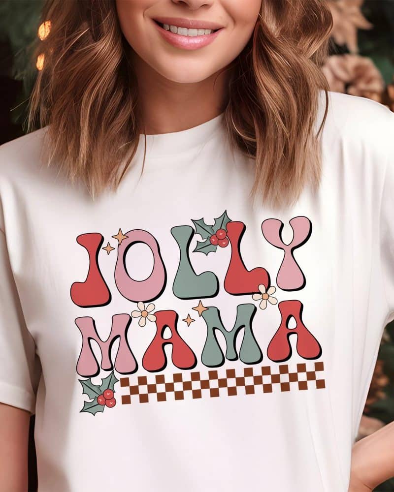 Woman wearing a white t-shirt with a retro-style Jolly Mama design.