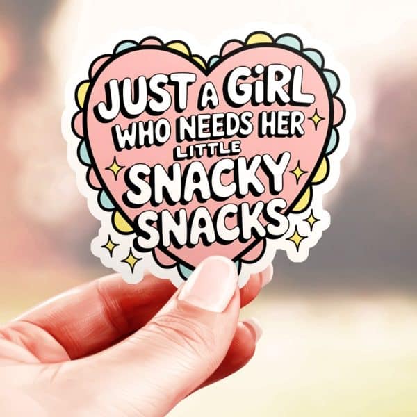 A Hand Holds A Heart-Shaped Sticker That Says, Just A Girl Who Needs Her Little Snaky Snacks.