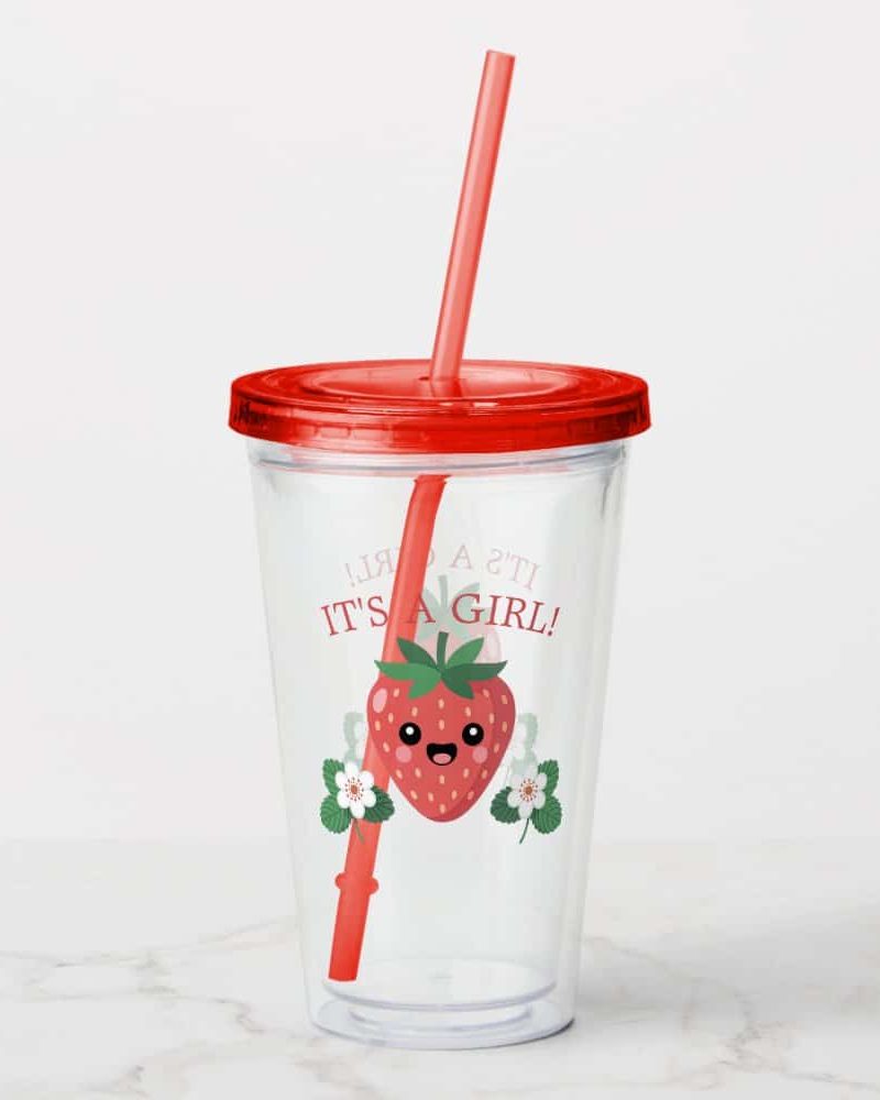 Clear plastic tumbler with a red lid and straw, featuring a cute cartoon strawberry and the text It's a Girl!