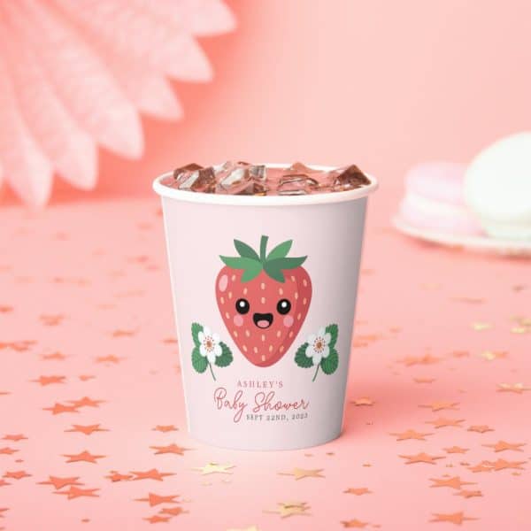 A Cup With Ice, Decorated With A Cartoon Strawberry And Text For Ashley'S Baby Shower.