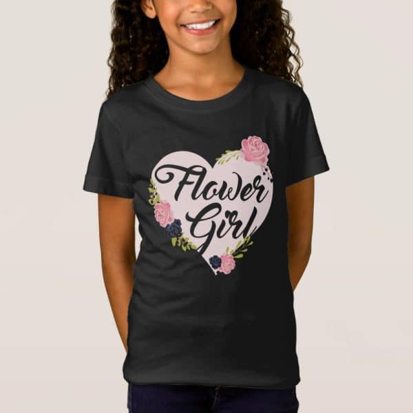 Black T-Shirt With A Pink Heart Design That Says Flower Girl. The Heart Is Decorated With Pink, Dark Blue, And Green Flowers.