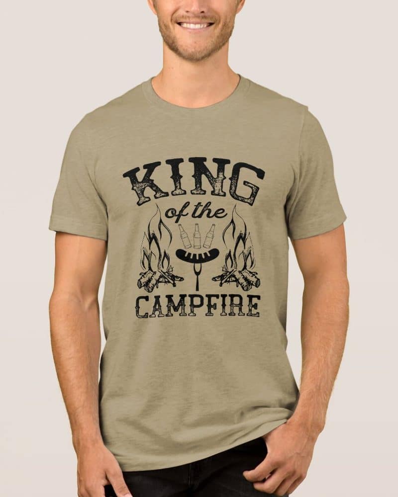 Tan t-shirt with a design reading King of the Campfire, showing a campfire with hotdogs and beer bottles.