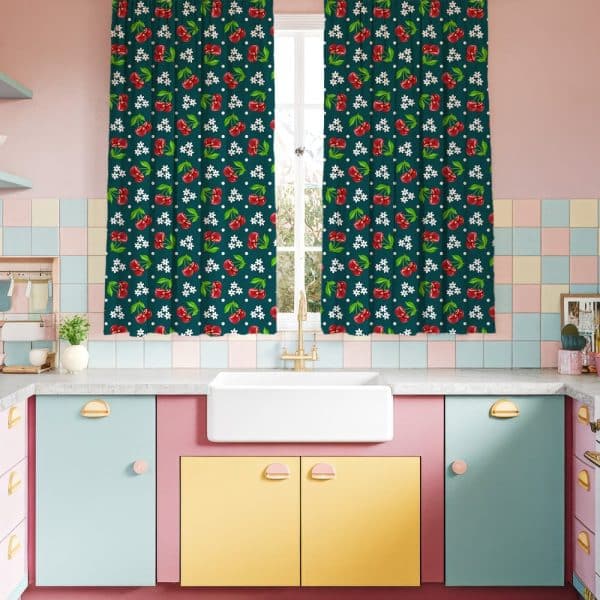 Dark Green Cherry-Print Curtains Hanging In A Retro Kitchen.
