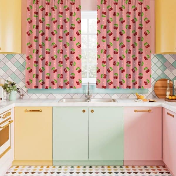 Pink Kitchen Curtains With A Repeating Pattern Of Cherries.
