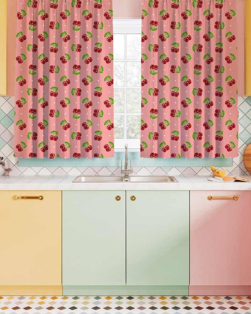 Pink kitchen curtains with a repeating pattern of cherries.