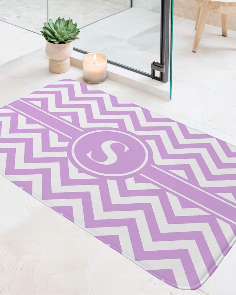 Lavender and white chevron bath mat with a monogrammed S.