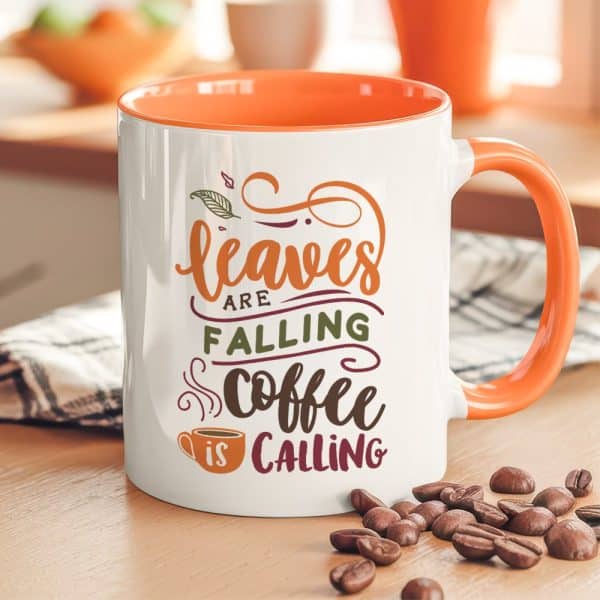 Orange-Handled Mug With Autumnal Design Reading Leaves Are Falling Coffee Is Calling.
