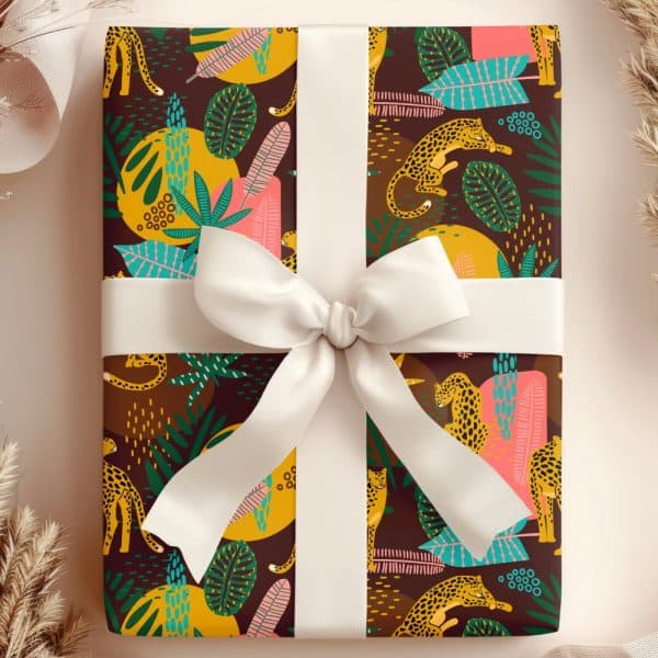 A Gift Wrapped In Brown Paper Featuring A Pattern Of Leopards And Tropical Leaves, Tied With A White Ribbon.