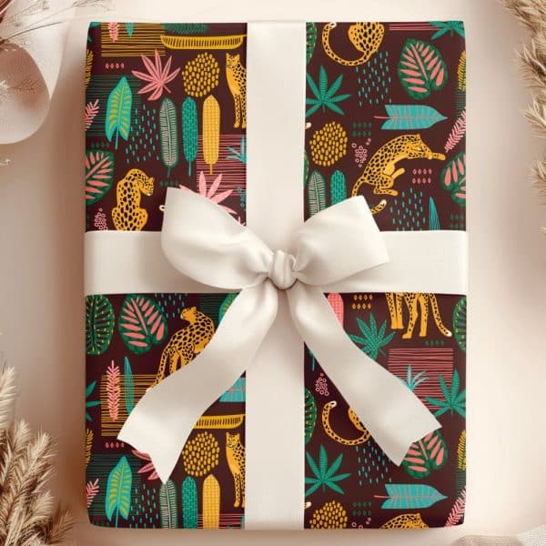 Gift Wrapped In Dark Brown Paper Featuring A Repeating Pattern Of Stylized Leopards And Tropical Leaves. A Large Off-White Bow Tops The Gift.