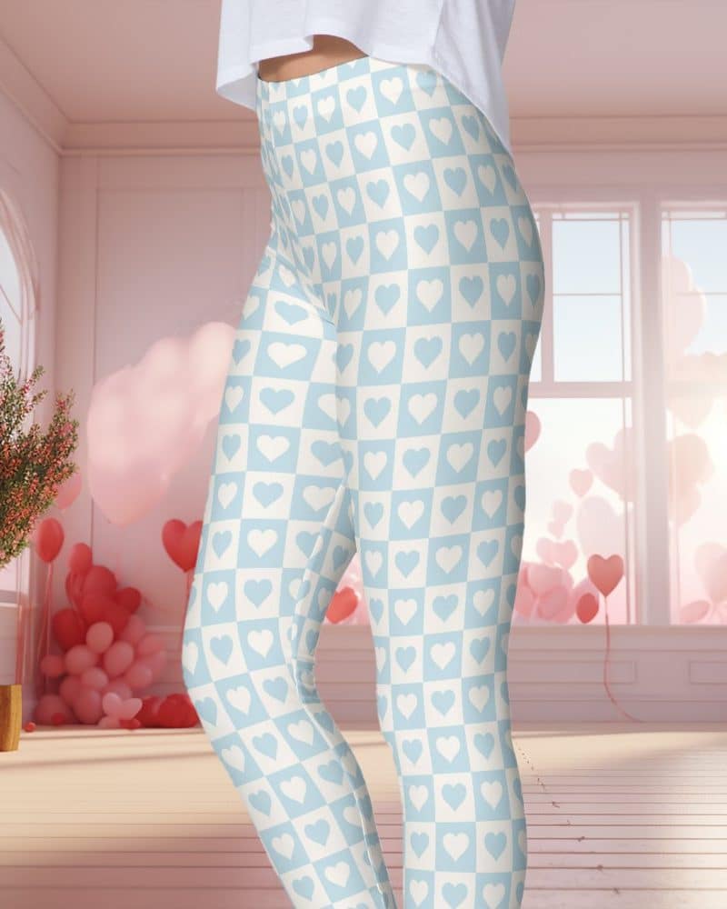Light blue leggings with a pattern of white hearts in a checkerboard design.