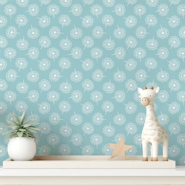 Light Teal Wall With A Repeating Pattern Of White Dandelions, Featuring A Small Wooden Giraffe And Star.