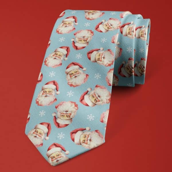 A Light Blue Necktie Featuring A Repeated Pattern Of Vintage Santa Claus Faces And Snowflakes.