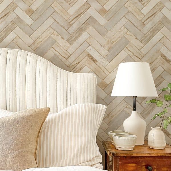 Beige Striped Headboard With Matching Pillows Against A Herringbone Patterned Wall.