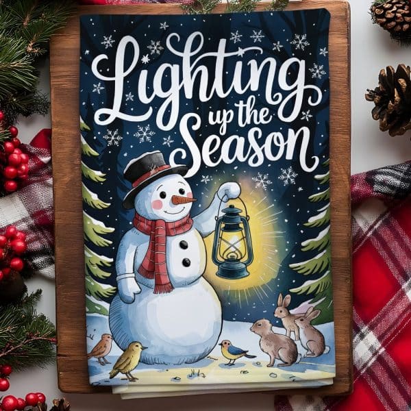 A Cheerful Snowman Holding A Lantern, Surrounded By Small Animals, In A Snowy Winter Scene. The Text &Quot;Lighting Up The Season&Quot; Is Displayed Above.