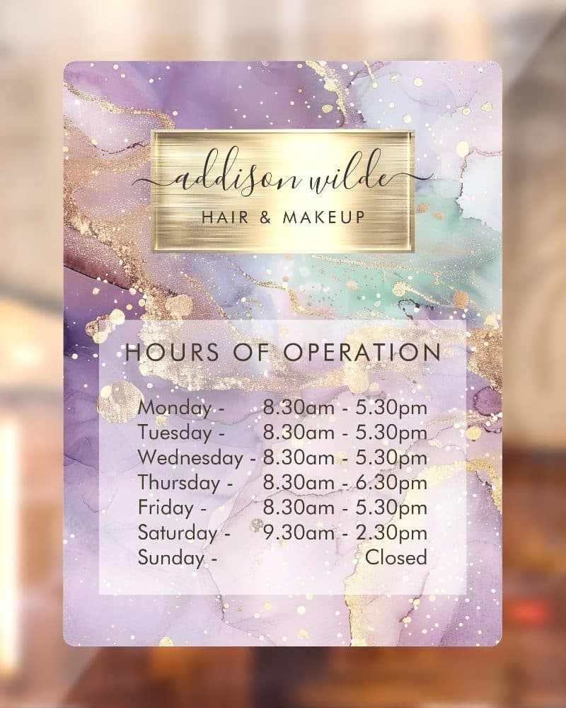 Addison Wilde Hair & Makeup business hours sign with a purple, green, and gold abstract background.