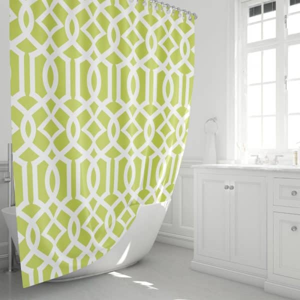 Lime Green And White Geometric Patterned Shower Curtain In A Bright Bathroom.