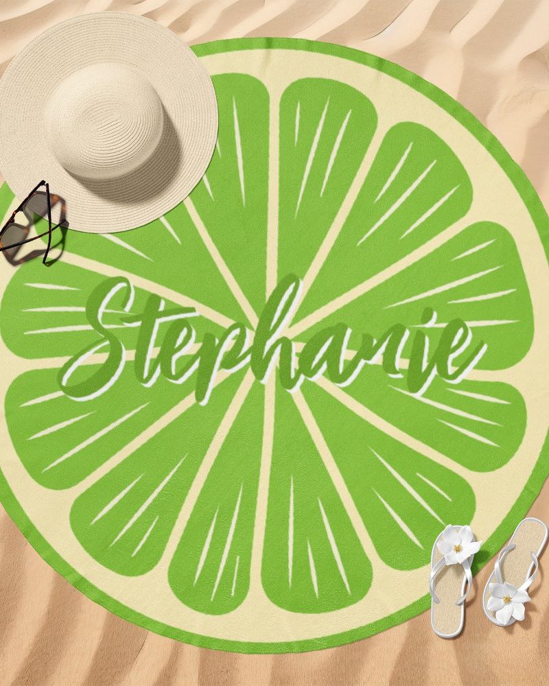 Round lime-slice beach towel with the name Stephanie on it.