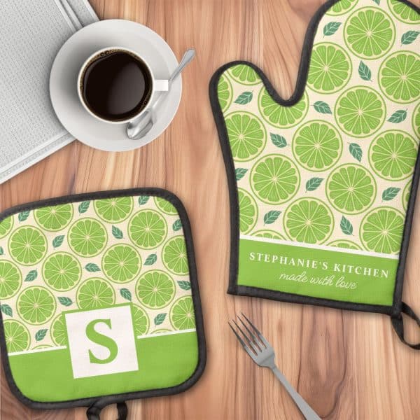 A Lime-Patterned Oven Mitt And Matching Pot Holder, Personalized With The Name Stephanie'S Kitchen.