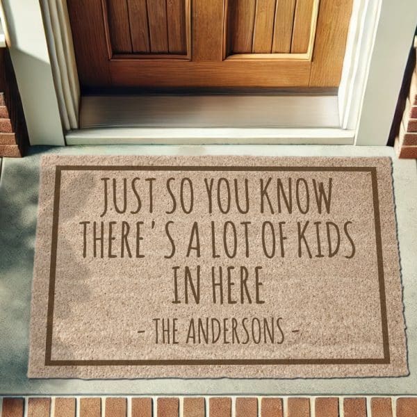 Beige Doormat With Brown Text Reading Just So You Know Theres A Lot Of Kids In Here The Andersons.