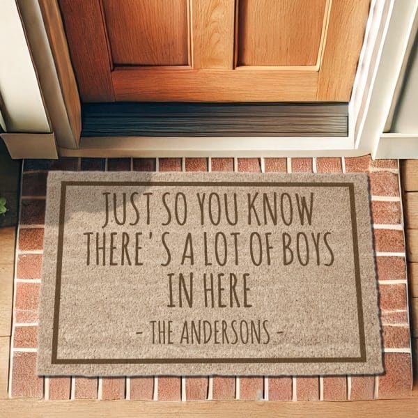 Beige Doormat With Brown Text Reading, Just So You Know There'S A Lot Of Boys In Here, Signed The Andersons.