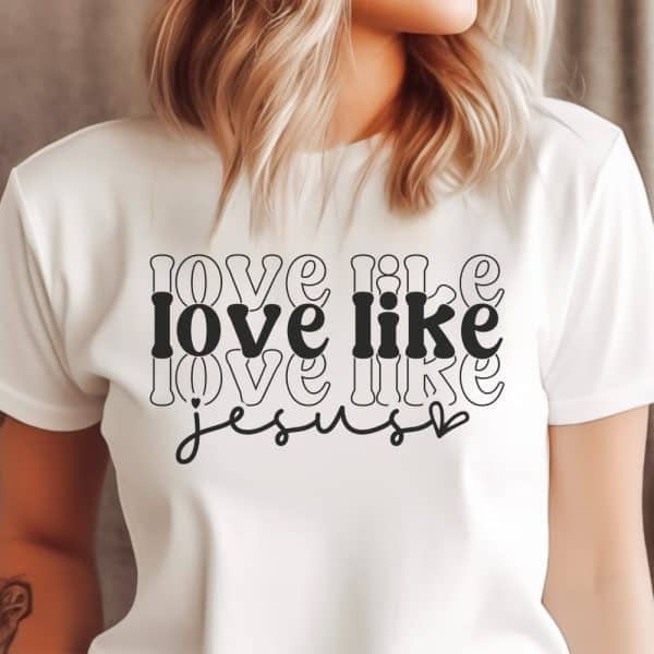 White T-Shirt With The Phrase Love Like Jesus In A Stylized Retro Font.
