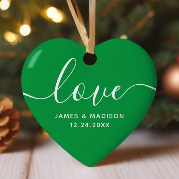 Green Heart-Shaped Christmas Ornament With The Word Love In Elegant Script And A Personalized Date Below.