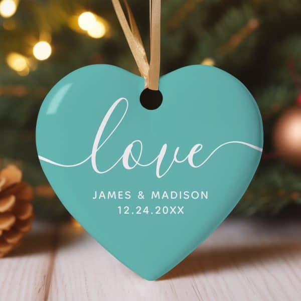 Teal Heart-Shaped Ornament With The Word Love And A Date.