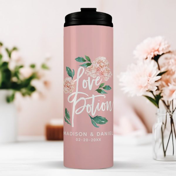 Pink Travel Tumbler With Black Lid, Featuring A Floral Design And The Words Love Potion. Personalized With A Couple'S Names And Date.