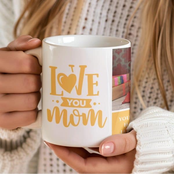 Person Holding A White Coffee Mug With A Yellow Love You Mom Design And A Small Photo Collage.