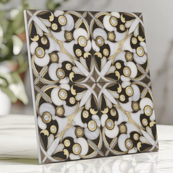 Ornate Square Tile With A Black, White, And Gold Floral Pattern.