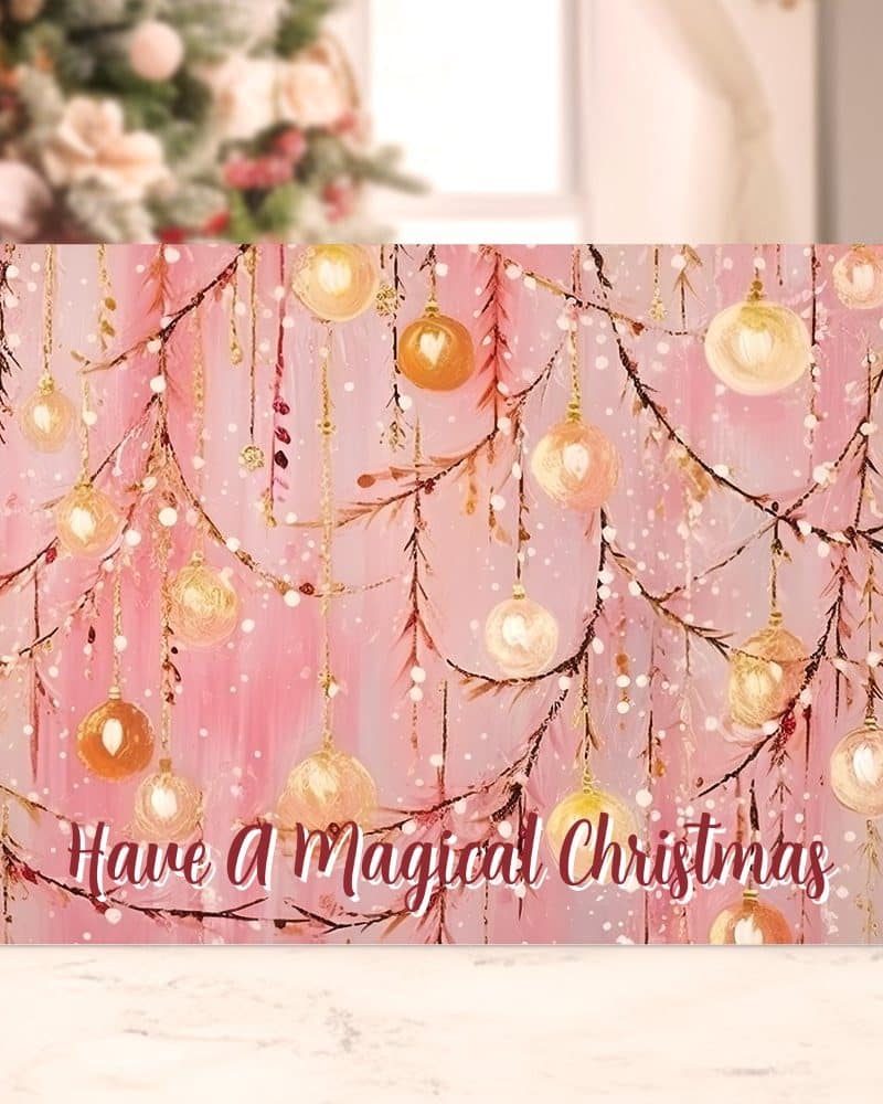 Pink Christmas card featuring a painted design of glowing ornaments hanging from branches, with the text Have A Magical Christmas.