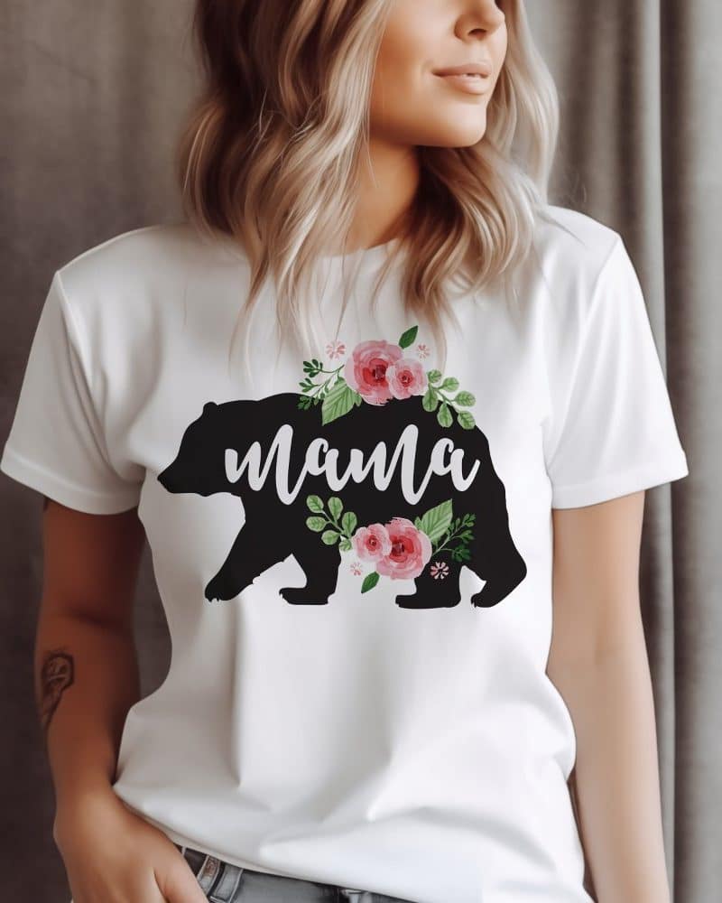 White t-shirt with a black bear silhouette, the word Mama, and pink flowers.
