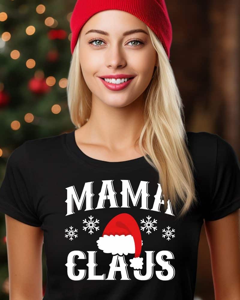 Woman wearing a black Mama Claus t-shirt and red beanie.