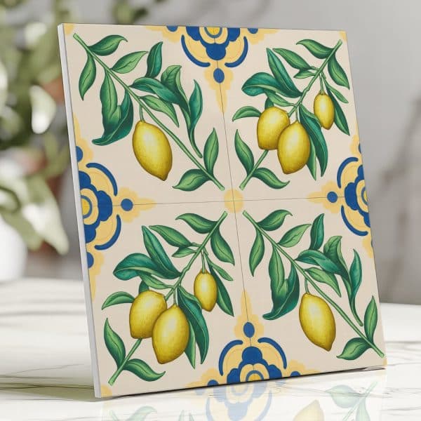 Tile Depicting Lemon Branches With Yellow Lemons And Green Leaves On A Cream Background With Blue And Yellow Floral Accents.